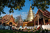 Chiang Mai - The Wat Phra Singh temple. The group of interesting buildings formed bay the  Ubosot and next to it the small attractive Viharn Lai Kham and the large gilded chedi. 